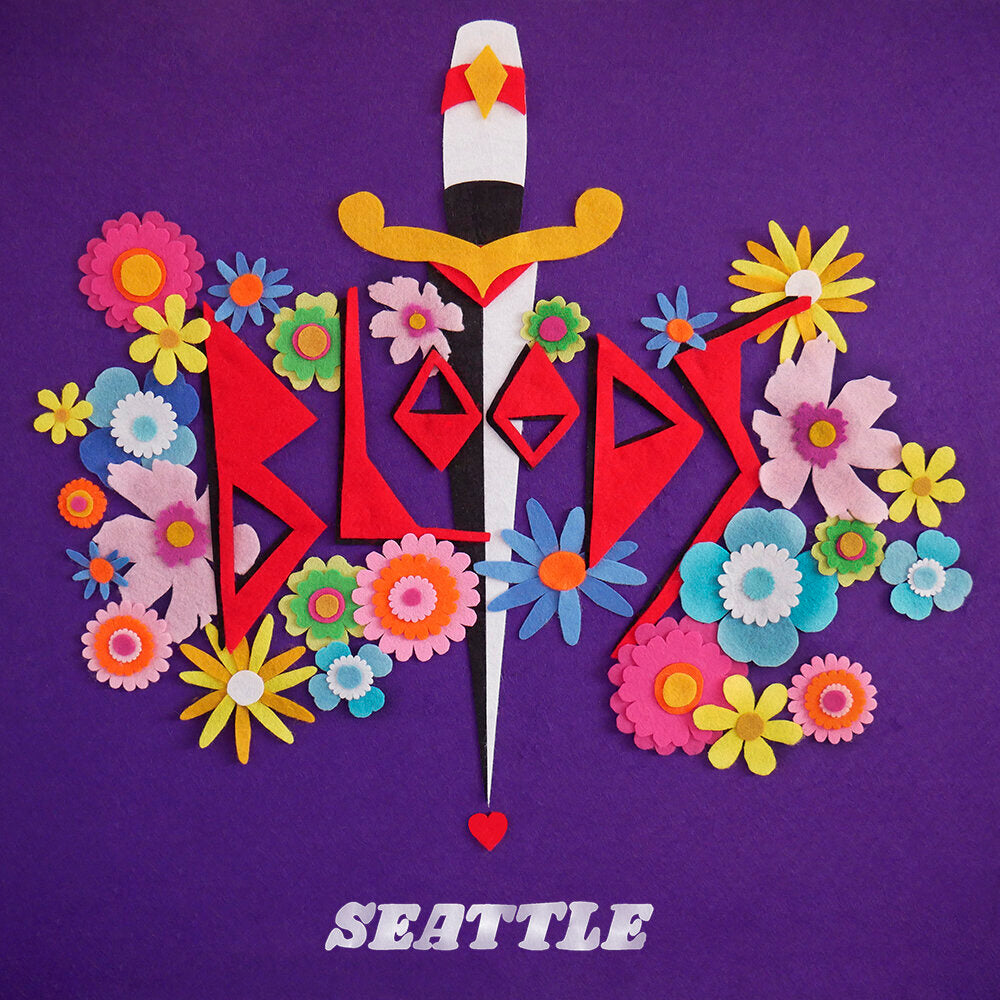 A colourful felt illustration depicting the band name ‘Bloods’, surrounded by vibrant flowers.