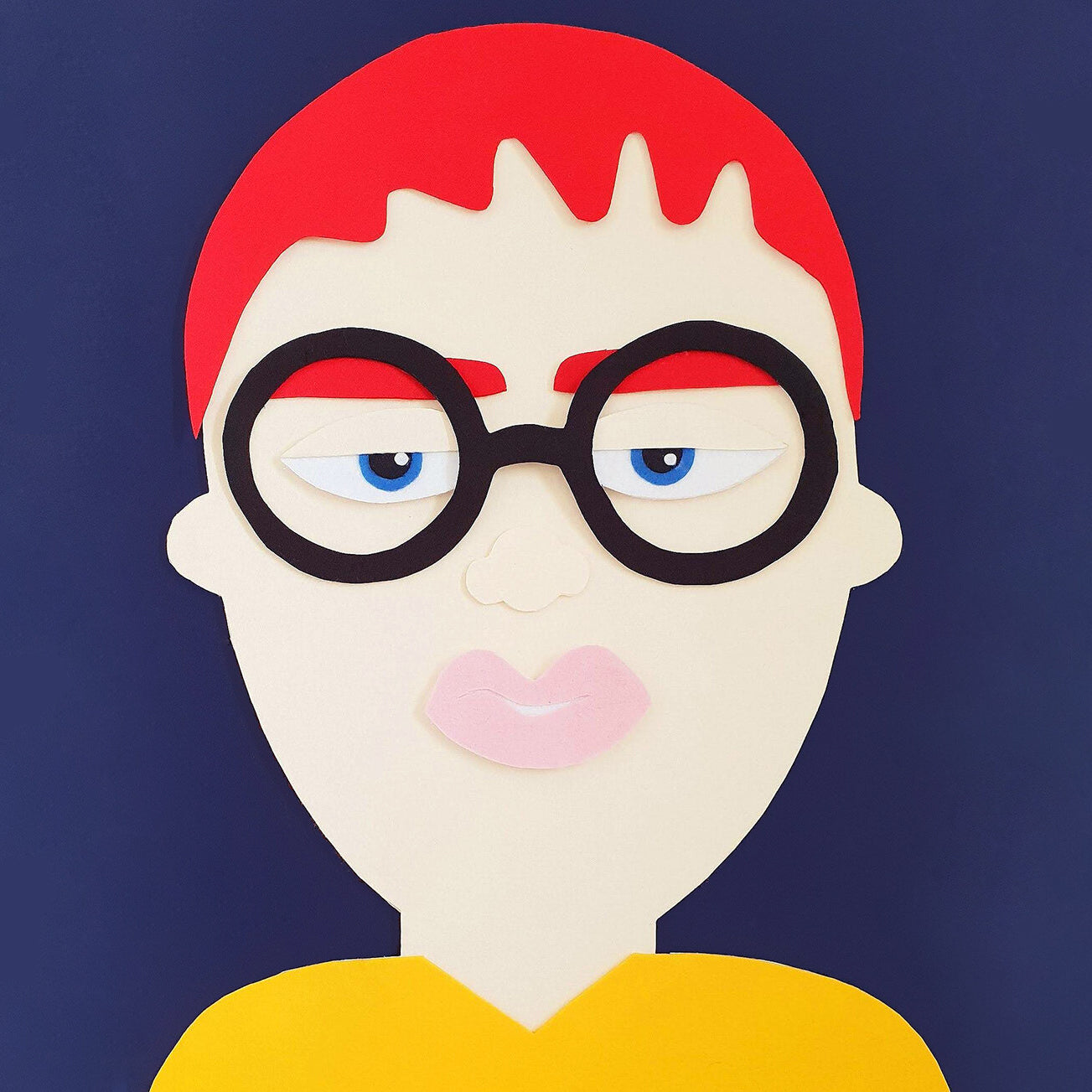 A felt collage installation of a white man with red hair and glasses, on a navy blue background.