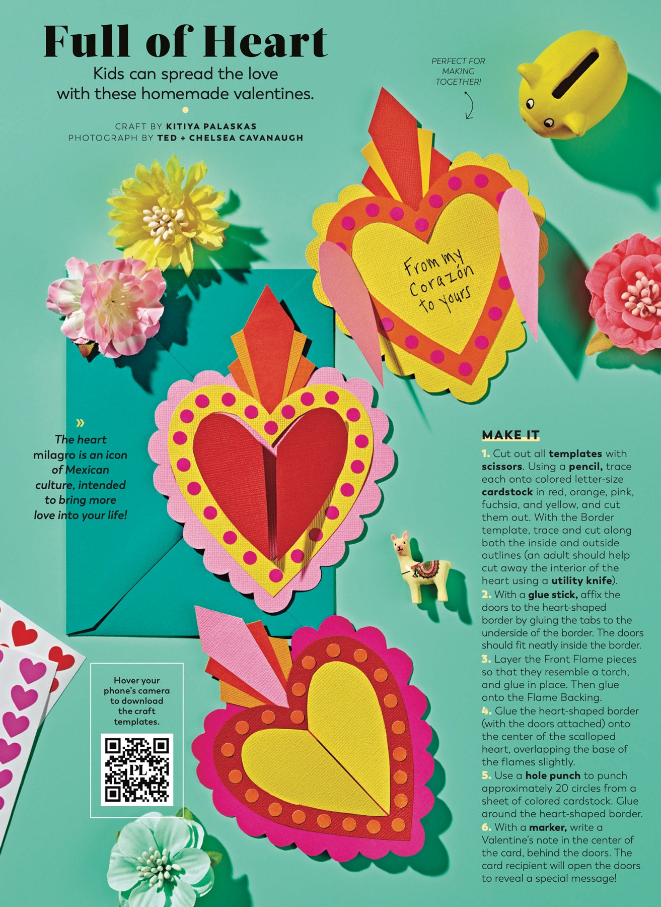 A collection of heart-shaped papercraft gift cards in bright, warm colours, sit against a teal background, surrounded by stationery and craft supplies. 